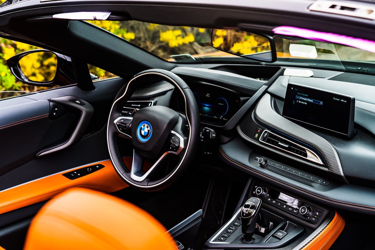 Home Sleek and modern BMW car interior showcasing a stylish steering wheel and digital dashboard.